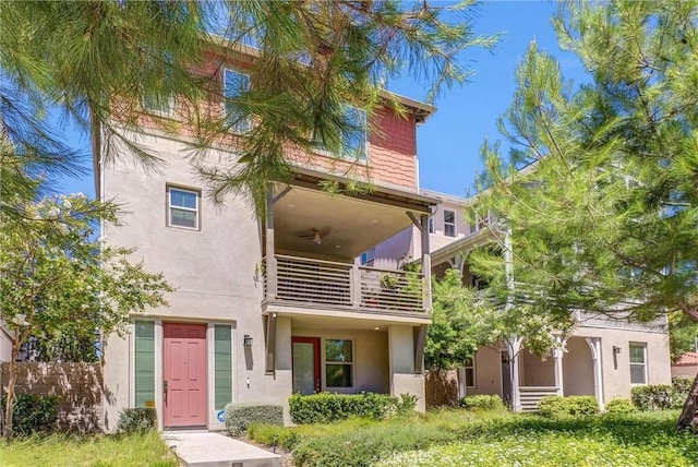 40 Riverton St, Phillips Ranch, CA 91766 - rear view of property with a balcony, stucco siding, and ceiling fan