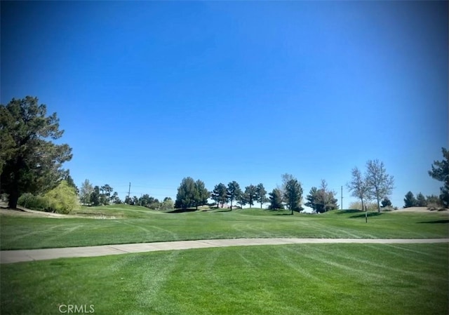 4011 Prestwick Ln, Palmdale, CA 93551 - surrounding community with golf course view and a lawn
