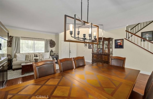 4011 Prestwick Ln, Palmdale, CA 93551 - dining room with a chandelier, crown molding, and stairway