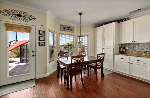 4011 Prestwick Ln, Palmdale, CA 93551 - dining room with dark wood-type flooring and ornamental molding