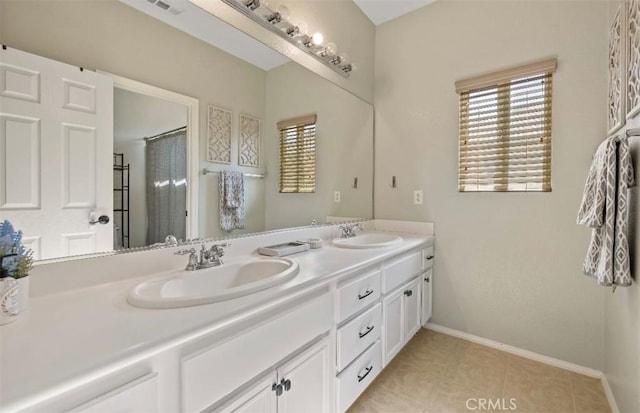 4011 Prestwick Ln, Palmdale, CA 93551 - bathroom featuring double vanity, tile patterned flooring, and a shower