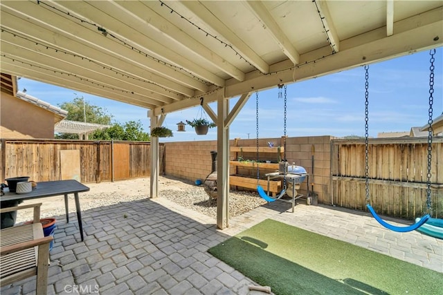 3026 Neary Ct, Rosamond, CA 93560 - fenced backyard featuring a patio area and a grill
