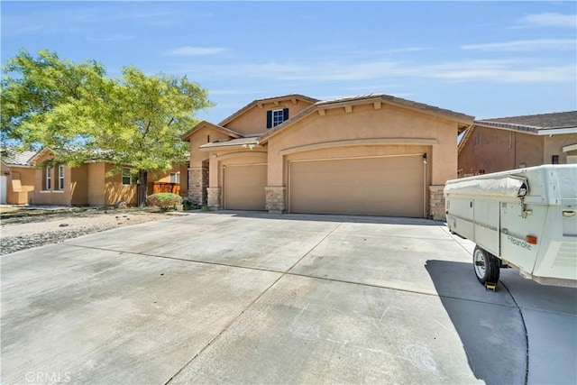 3026 Neary Ct, Rosamond, CA 93560 - view of front of house with stone siding, an attached garage, concrete driveway, and stucco siding