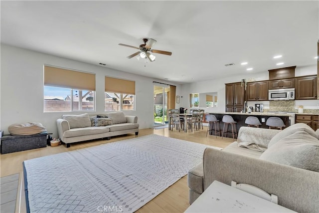 3026 Neary Ct, Rosamond, CA 93560 - living area featuring a ceiling fan, recessed lighting, and light wood-type flooring