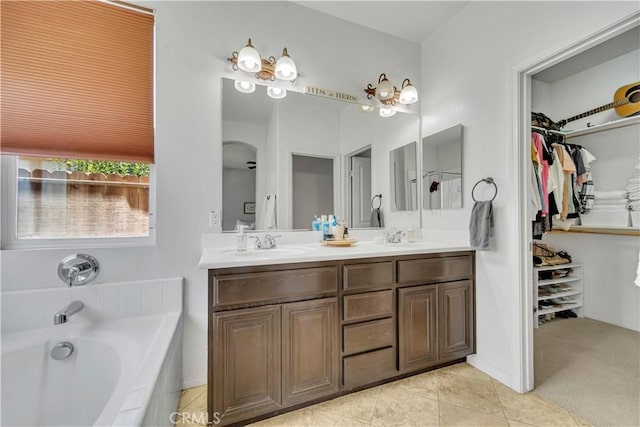 3026 Neary Ct, Rosamond, CA 93560 - full bath featuring double vanity, a bath, a walk in closet, and tile patterned flooring