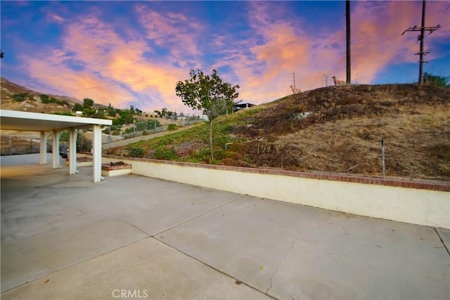 8555 Pigeon Pass Rd, Moreno Valley, CA 92557 - patio terrace at dusk with a patio