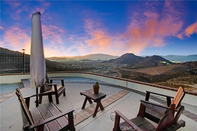 8555 Pigeon Pass Rd, Moreno Valley, CA 92557 - patio terrace at dusk with a mountain view