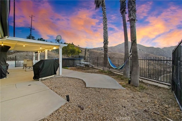 8555 Pigeon Pass Rd, Moreno Valley, CA 92557 - view of yard with a mountain view and a patio