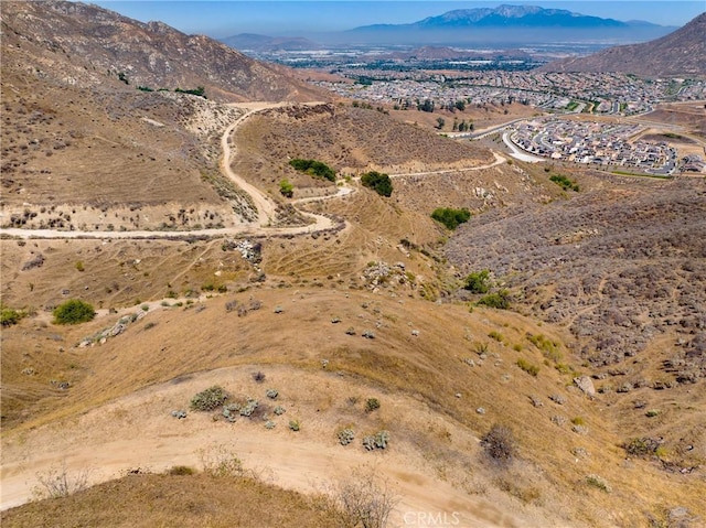 8555 Pigeon Pass Rd, Moreno Valley, CA 92557 - aerial view of property's location featuring a mountain backdrop and rural landscape