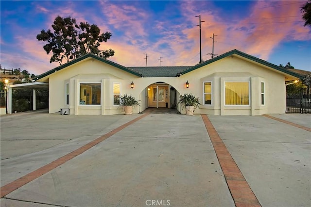 8555 Pigeon Pass Rd, Moreno Valley, CA 92557 - view of front of property with stucco siding and driveway