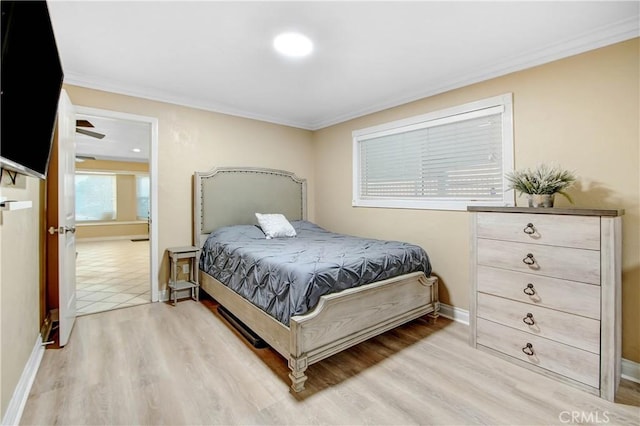 8555 Pigeon Pass Rd, Moreno Valley, CA 92557 - bedroom featuring light wood-style flooring and crown molding