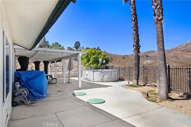 8555 Pigeon Pass Rd, Moreno Valley, CA 92557 - fenced backyard featuring a patio and a mountain view