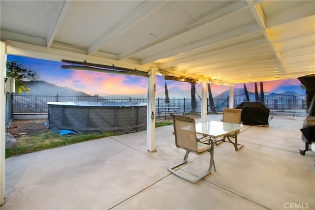 8555 Pigeon Pass Rd, Moreno Valley, CA 92557 - fenced backyard featuring grilling area, outdoor dining area, and a patio area