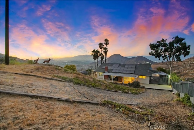 8555 Pigeon Pass Rd, Moreno Valley, CA 92557 - yard at dusk with a mountain view