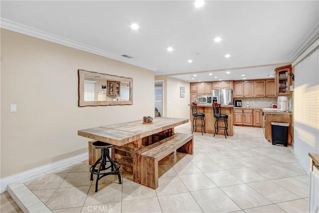 8555 Pigeon Pass Rd, Moreno Valley, CA 92557 - dining room with crown molding, recessed lighting, and light tile patterned flooring