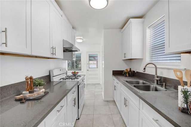 1510 E Idahome St, West Covina, CA 91791 - kitchen featuring gas range gas stove, exhaust hood, white cabinetry, and plenty of natural light