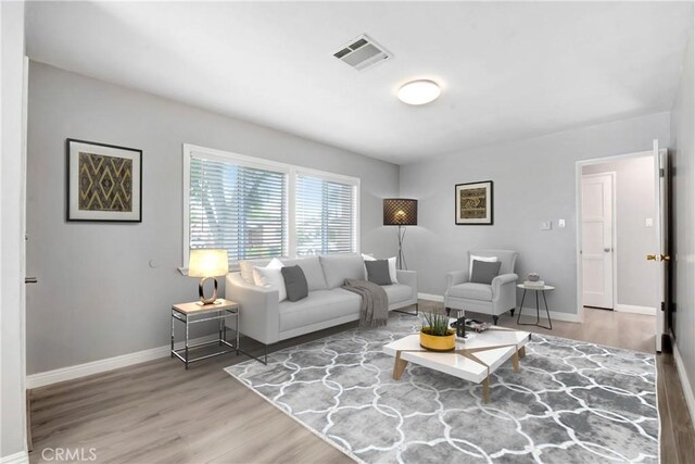 1510 E Idahome St, West Covina, CA 91791 - living room featuring wood finished floors and baseboards