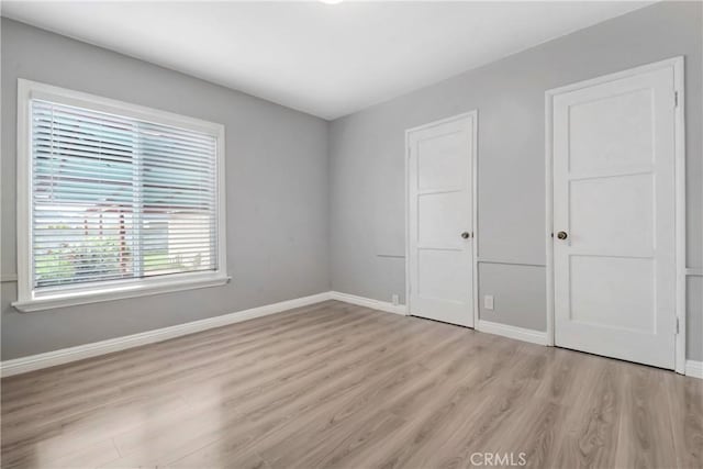 1510 E Idahome St, West Covina, CA 91791 - unfurnished bedroom featuring light wood-type flooring and baseboards