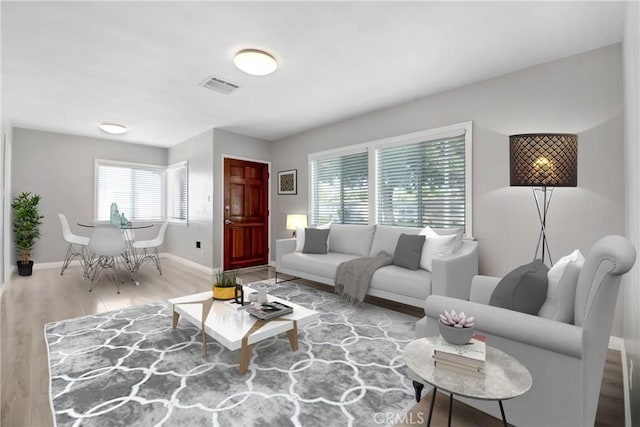 1510 E Idahome St, West Covina, CA 91791 - living area featuring wood finished floors and baseboards