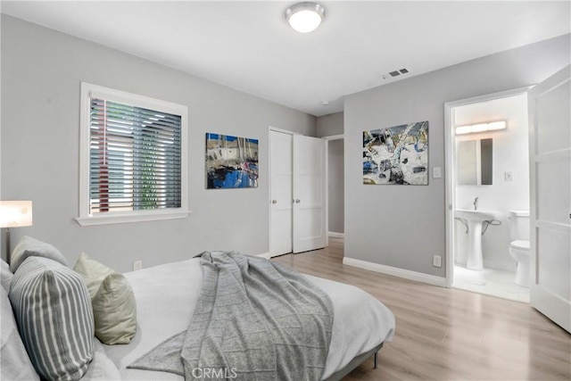 1510 E Idahome St, West Covina, CA 91791 - bedroom featuring wood finished floors, ensuite bathroom, and a closet