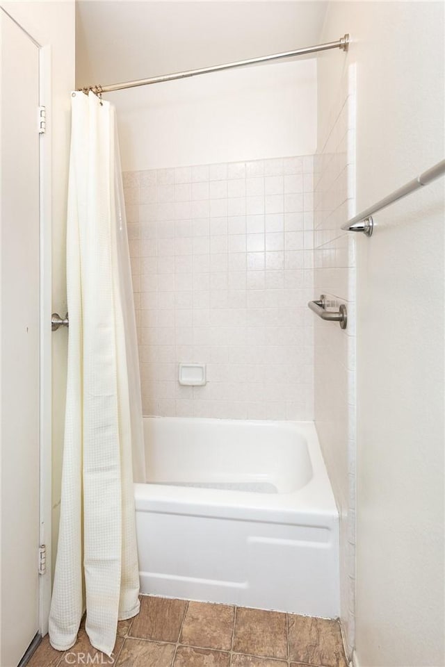 7800 Topanga Canyon Blvd Unit 324, Canoga Park, CA 91304 - bathroom with shower / bathtub combination with curtain