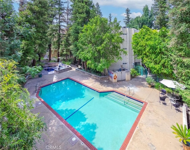 7800 Topanga Canyon Blvd Unit 324, Canoga Park, CA 91304 - community pool featuring a patio area