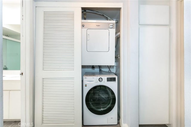 7800 Topanga Canyon Blvd Unit 324, Canoga Park, CA 91304 - washroom with stacked washer / dryer