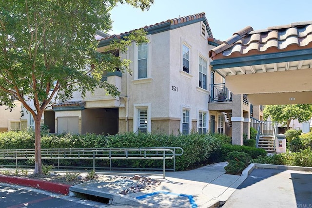 3521 Caminito El Rincon Unit 307, San Diego, CA 92130 - view of property featuring stairs
