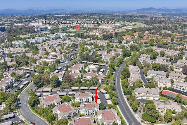 3521 Caminito El Rincon Unit 307, San Diego, CA 92130 - aerial overview of property's location with mountains and nearby suburban area