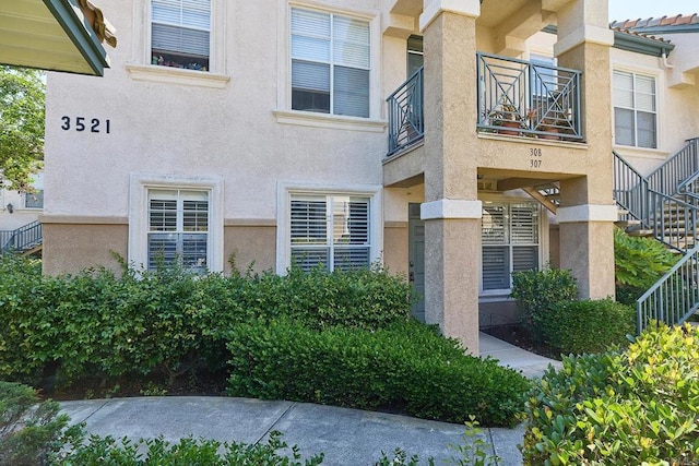 3521 Caminito El Rincon Unit 307, San Diego, CA 92130 - doorway to property with stucco siding