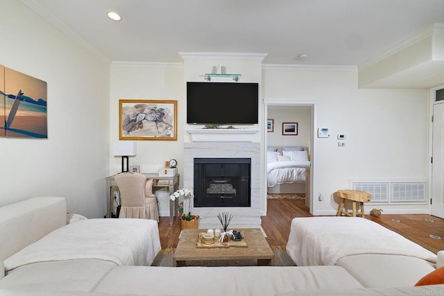 3521 Caminito El Rincon Unit 307, San Diego, CA 92130 - living room with crown molding, a high end fireplace, wood finished floors, and recessed lighting
