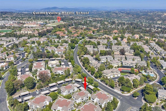 3521 Caminito El Rincon Unit 307, San Diego, CA 92130 - aerial overview of property's location with nearby suburban area and a mountainous background
