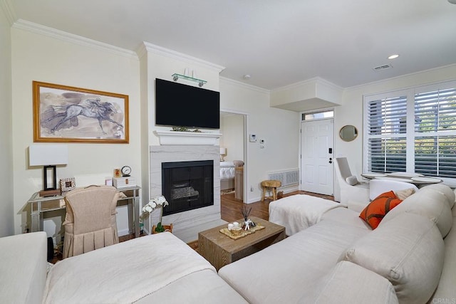 3521 Caminito El Rincon Unit 307, San Diego, CA 92130 - living room with ornamental molding, a high end fireplace, wood finished floors, and recessed lighting
