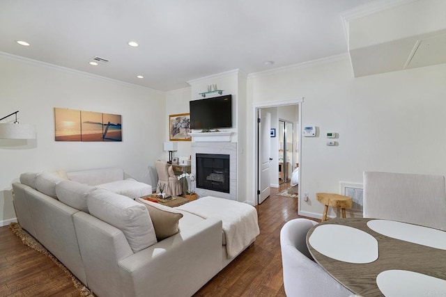 3521 Caminito El Rincon Unit 307, San Diego, CA 92130 - living room with crown molding, dark wood-style floors, a fireplace, and recessed lighting