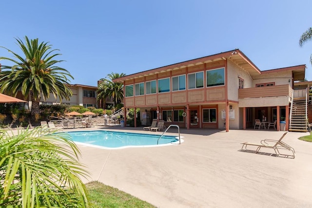 6812 Hyde Park Dr Unit G, San Diego, CA 92119 - community pool featuring a patio and stairway