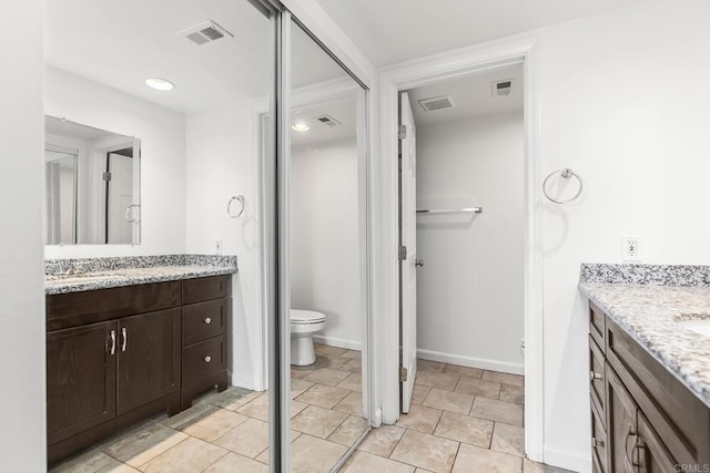 6812 Hyde Park Dr Unit G, San Diego, CA 92119 - bathroom with two vanities and recessed lighting