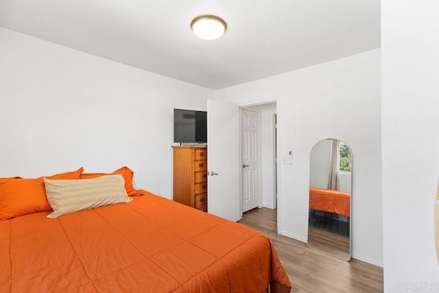 7023 Lisbon St, San Diego, CA 92114 - bedroom featuring wood finished floors and arched walkways