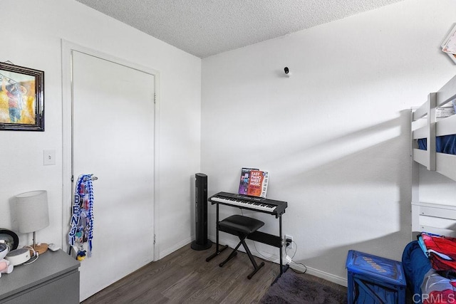 7023 Lisbon St, San Diego, CA 92114 - bedroom featuring dark wood-style flooring and a textured ceiling