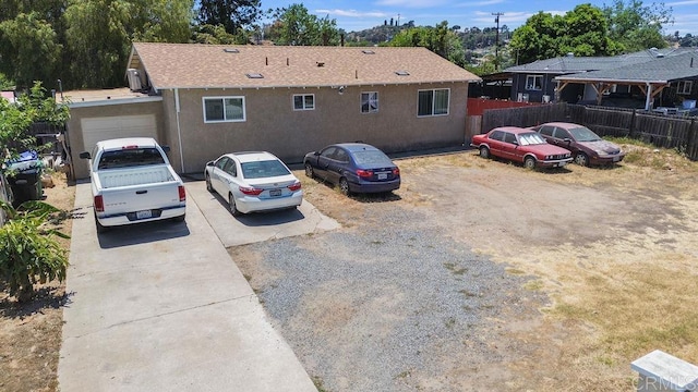 7023 Lisbon St, San Diego, CA 92114 - view of front of home with stucco siding and a garage