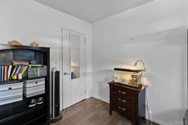 7023 Lisbon St, San Diego, CA 92114 - office featuring dark wood finished floors and a textured ceiling