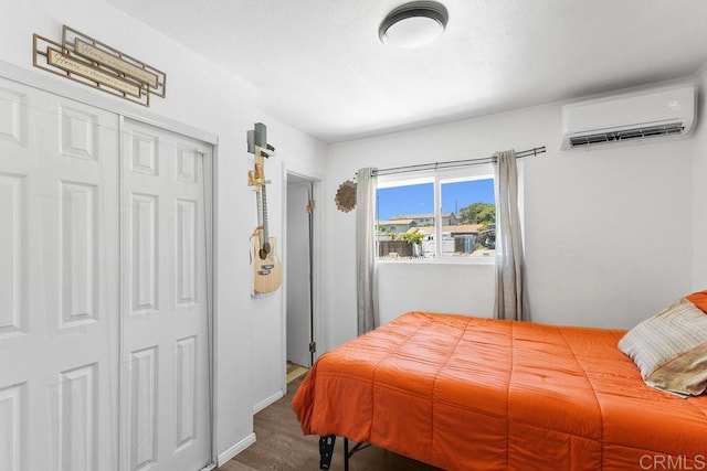 7023 Lisbon St, San Diego, CA 92114 - bedroom featuring a wall mounted air conditioner, wood finished floors, and a closet