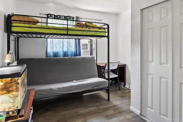 7023 Lisbon St, San Diego, CA 92114 - bedroom featuring wood finished floors and a textured ceiling