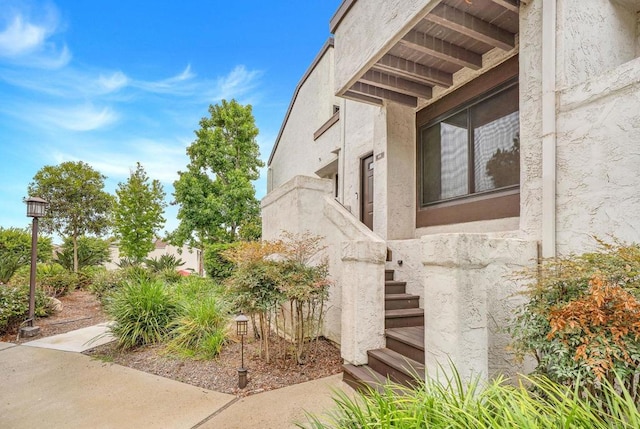 2282 Caminito Pescado Unit 44, San Diego, CA 92107 - view of property exterior with stairs and stucco siding
