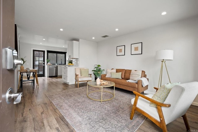 2282 Caminito Pescado Unit 44, San Diego, CA 92107 - living area with dark wood-style floors and recessed lighting