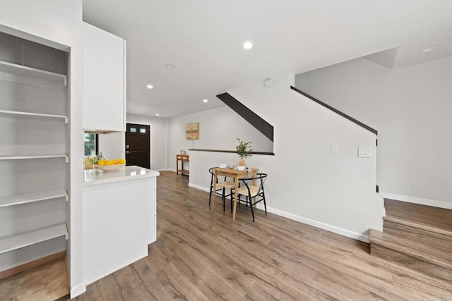 2282 Caminito Pescado Unit 44, San Diego, CA 92107 - living room featuring wood finished floors, recessed lighting, and stairs