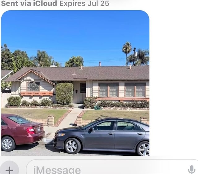 16931 E Rinaldi St, Granada Hills, CA 91344 - single story home with board and batten siding, roof with shingles, and a front lawn