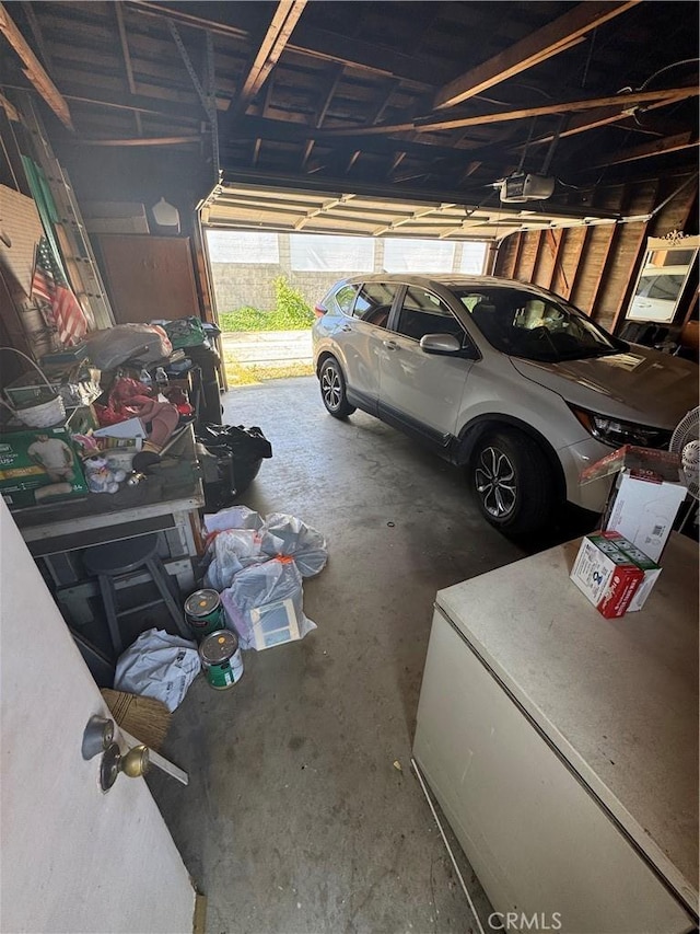 16931 E Rinaldi St, Granada Hills, CA 91344 - garage featuring a garage door opener