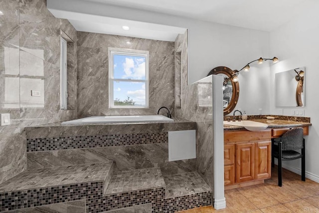 20202 Deerhorn Valley Rd, Jamul, CA 91935 - bathroom featuring a garden tub, vanity, and tile patterned flooring