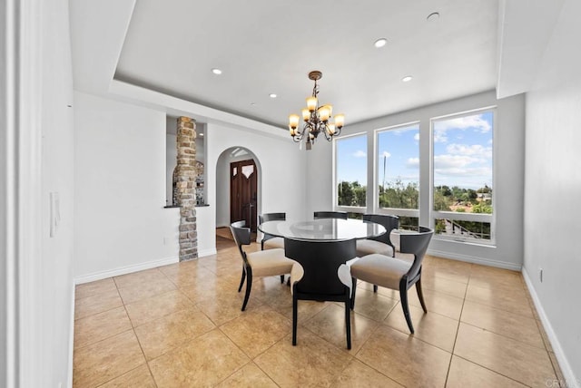 20202 Deerhorn Valley Rd, Jamul, CA 91935 - dining area with arched walkways, a chandelier, light tile patterned floors, recessed lighting, and decorative columns