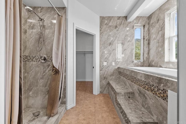 20202 Deerhorn Valley Rd, Jamul, CA 91935 - full bathroom featuring a tile shower, tile patterned floors, tiled bath, and a walk in closet